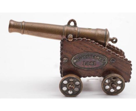 Battle of Copenhagen 1801. An early 19th century small brass and oak desk cannon with copper plaque 'Copenhagen 1801': the  f