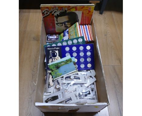 As new fashion watches, postcards, historic car tokens, LP's, football trading cards and The Ultimate Football Hero books