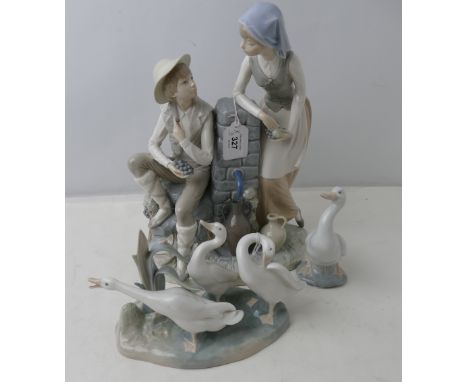 Large Nao figurine of boy and girl eating grapes, Lladro figure of geese and another Nao figure of geese