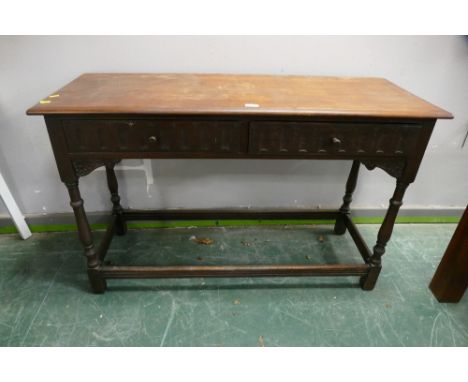 Carved front oak two drawer side table 