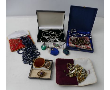 Three yellow metal brooches, beaded necklaces and large mineral stone pendants mounted on white metal chains