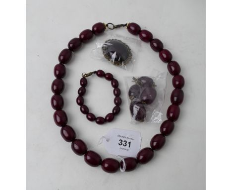 Cherry amber coloured resin suite to include necklace, ear pendants, bracelet and brooch