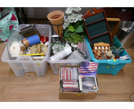 Four boxes of ceramics, ornaments, display cases, CD's etc