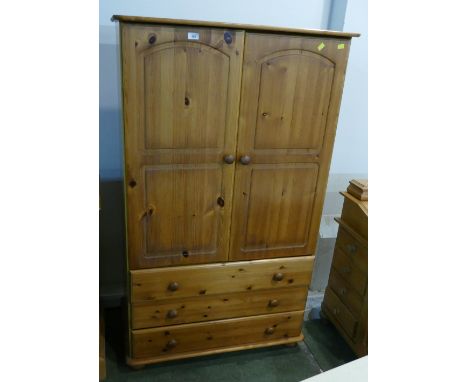 Pine wardrobe with three drawers to base 