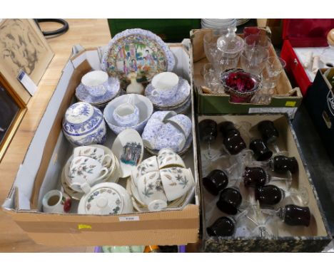 Three boxes of coloured glassware, blue and white part tea sets, ornaments etc