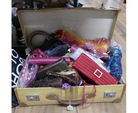 Vintage suitcase containing ladies fashion bags 