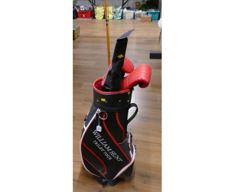 William Hunt golf bag, vintage fishing rods, Karim boxing gloves and clock pendulum on board