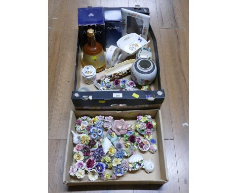 Two boxes of floral posies, Aynsley picture frame, wheelbarrow, clocks and trinkets, empty Bells Whisky bell
