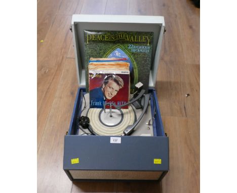 Vintage Defiant record player with quantity of vinyl singles 