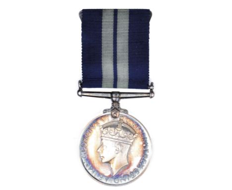 The Distinguished Service Medal to Engine Room Artificer Ivan Charles Glover who served in H.M.S. Penelope throughout the Sec