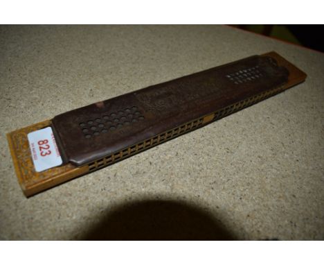 A vintage harmonica 'Ands Kochs Famous Giant Harmonica'