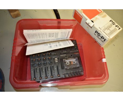 A vintage TASCAM Porta One Ministudio 4-Track Cassette Recorder, complete with power supply
