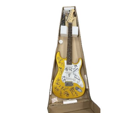 An Aria electric guitar, bearing the signatures of various 1960s bands in black ink, to include:  - Brian Huggins (Edison Lig