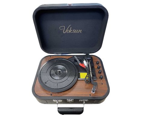 A cased Voksun 7" record player with built in speakers