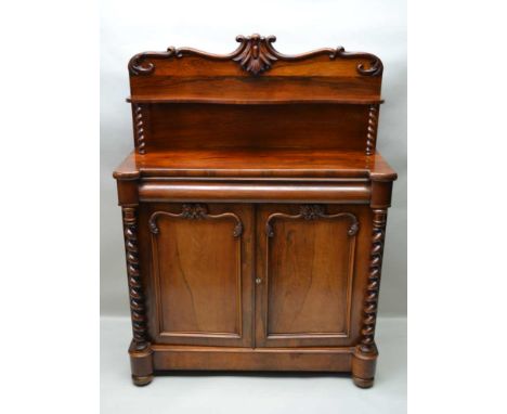 A 19th CENTURY ROSEWOOD CHIFFONIER, the shaped back with acanthus scrolls and shelf raised with barley twists, the base fitte