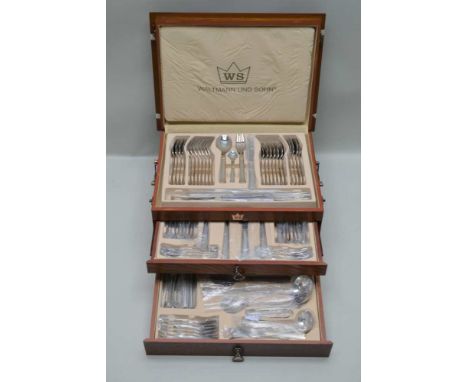 WALTMAND AND SOHN A CANTEEN OF CUTLERY FOR EIGHT PLACE SETTINGS, includes ladle etc in a polished wood table cabinet with hin