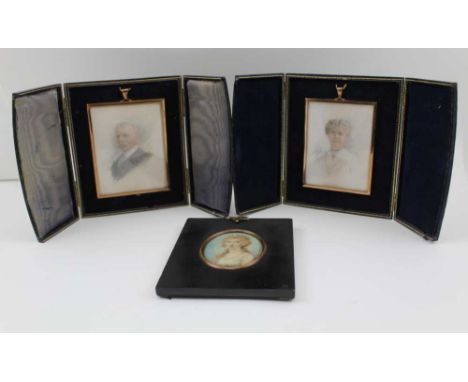 A PAIR OF GEORGE V PERIOD FRAMED MINIATURE PORTRAITS, a lady and a gentleman, both monogrammed "I.A.", and dated 1920, 10.5cm