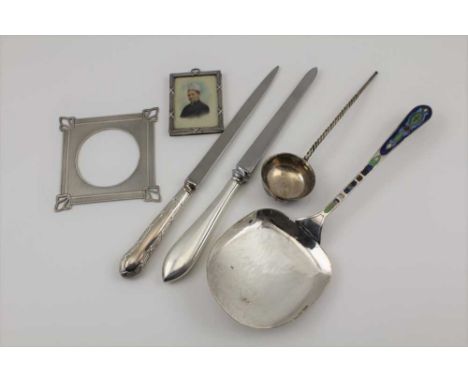 TWO SILVER HANDLED LETTER OPENERS, a Continental miniature frame of bound reed design, stamped .800, containing a colour tint