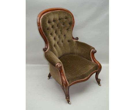 A LATE VICTORIAN SHOW WOOD FRAMED BUTTON BACK EASY CHAIR, with scroll terminal arms and scroll toe feet on ceramic castors, i