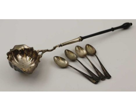 A MID 18TH CENTURY SILVER TODDY LADLE, having double pouring lip bowl of fluted form, London 1749, on a slender turned ebonis