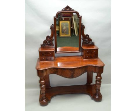 A LATE VICTORIAN MAHOGANY MIRROR BACK DUCHESSE DRESSING TABLE, the top fitted two banks of jewellery drawers, over serpentine