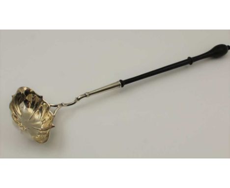 A GEORGE III SILVER TODDY LADLE, with double pouring lip, fluted form bowl attached to a slender turned wood handle, hallmark