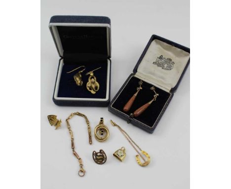 A 9CT GOLD HORSESHOE MOUNTED STICK PIN, and various other items of yellow metal to include a pair of ornate earrings, cased 