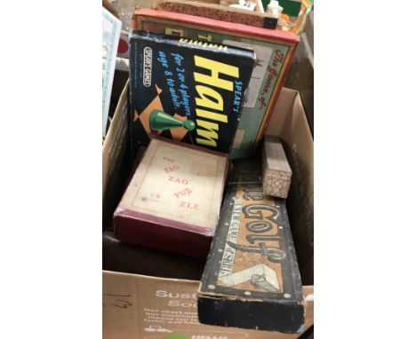 A box of assorted vintage games to include a ZigZag puzzle, "Table Golf - a New Game of Skill" by R M Coe Ltd, "Curli-Shoot" 