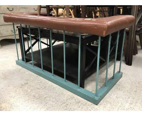 An early 20th Century club fender, the buttoned leather top above a painted metal base, external seat size 121 cm wide x 59 c