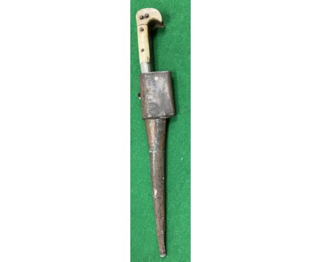 A 19th Century Yataghan dagger with bone handle and shaped blade housed in a plain brass scabbard, 38 cm long over all