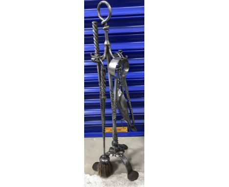 A Cotswold School Arts and Crafts iron companion set by Thornton & Downer of Chipping Campden, comprising stand with opposing