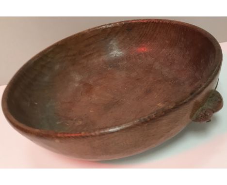 A Mouseman oak shallow bowl with mouse on the side, 24 cm diameter x 7 cm high CONDITION REPORTS In need of a good clean.  So