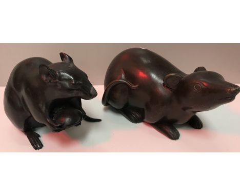 A bronze figure of a rat holding a nut, 10 cm high x 16 cm long together with a further similar bronze model of a rat, 9 cm h