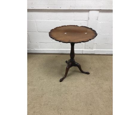 A late George III mahogany occasional table, the circular pie crust snap top on a birdcage to baluster turned pedestal to cab
