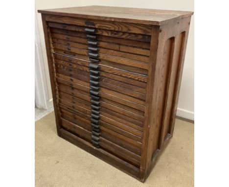 A circa 1900 American oak printer's chest of 24 drawers with cup handles by Hamilton, bearing metal label inscribed "Wood Goo