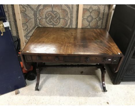 A 19th Century mahogany sofa table, the rounded rectangular drop-leaf top cross-banded in rosewood, over two frieze drawers w