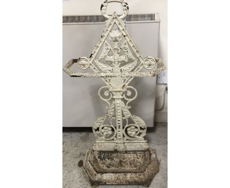 A Victorian white painted cast iron stick stand in the Aesthetic taste by T J Woolford, bearing kite mark to underside of dri