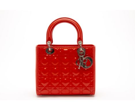 A CHRISTIAN DIOR MEDIUM LADY DIOR RED PATENT LEATHER HANDBAG
Glossy patent leather with a quilted pattern embroidered body, w