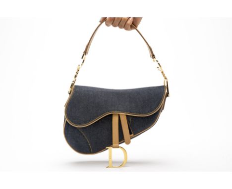 A CHRISTIAN DIOR BLUE DEMIN SADDLE BAG
With beige leather handle strap and details, with gold-tone hardware, with flap top an