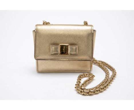 A SALVATORE FERRAGAMO GINNY GOLD LEATHER SHOULDER BAG
Textured leather body, flap top with push-button claps, with gold-tone 
