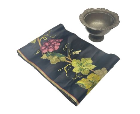 Silk runner, embroidered with fruiting grape vines, on a black ground, L216cm, W21.5cm, together with a Oriental brass pedest