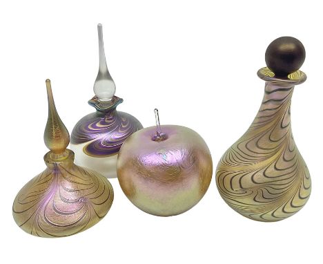Four Okra scent bottles, the first example modelled as an apple, the second of squat form decorated with iridescent threads u