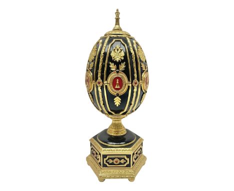 Franklin Mint House of Faberge; The Imperial Jeweled Egg Chess set, the egg opening to reveal a chess board, with a draw to t