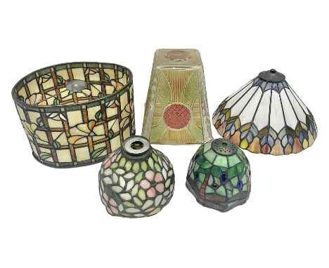Tiffany style lamp shade, of oval form, with pale peach flowers on a cream and orange lattice ground, together with three oth