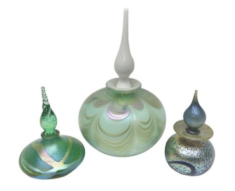 Three Okra scent bottles, the first example decorated with iridescent threads and pulls over a green ground, with a white sto