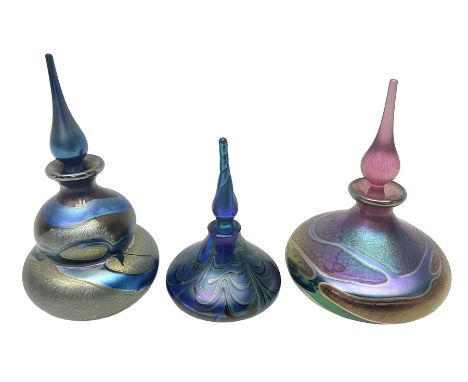 Three Okra scent bottles, the first example of gourd form, decorated with iridescent threads in blues, greens and browns, ano