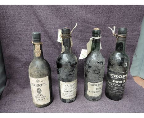 Four bottles of Vintage Port, Croft 1963, Taylor's 1963,seapage seen, Cockburn's 1970 and Warre's 1975, full size bottles, no