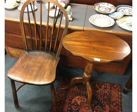 An Antique stick back chair together with a table.