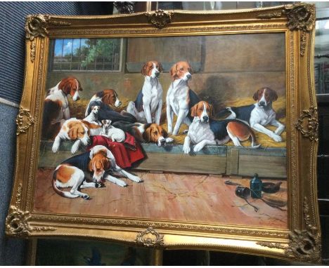 An oversized gilt framed oil on canvas of a group of hounds. Signed to bottom right: R Evans. Approx. 120cms x 90cms.
