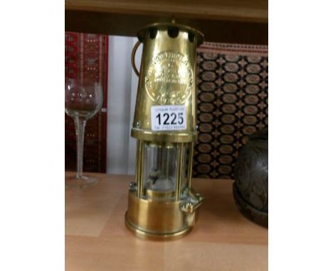 A brass miner's lamp.